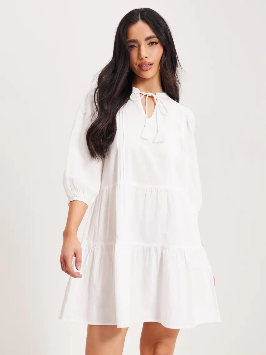 TRAPEZOWA MINI SUKIENKA V-NECK WIĄZANIE HAFT